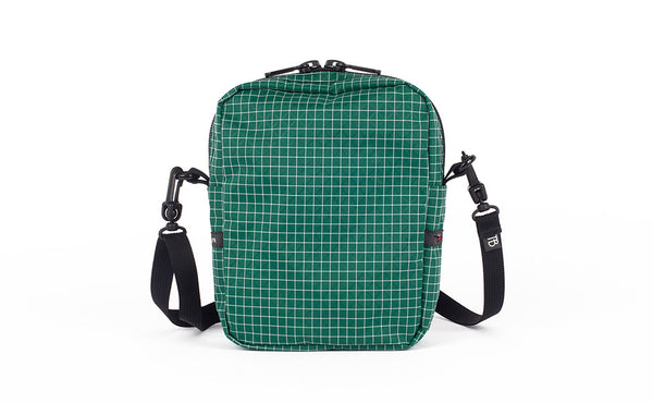 A back view of the Everyday Cubelet in Sitka Halcyon (green with a white grid) showing a completely fabric back.